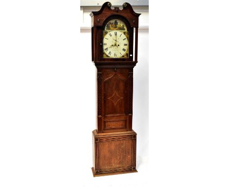 M. JONES, CARNARVAN; a George III oak eight-day longcase clock, the broken swan neck pediment terminating in brass roundels, 