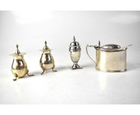 THOMAS HAYES; a Victorian hallmarked silver lidded table salt with blue glass liner and associated caddy spoon, Birmingham 19