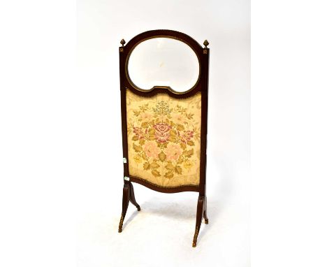 A French walnut fire screen with bevelled glazed panel above a woven tapestried insert panel, with gilt metal mounts, to outs