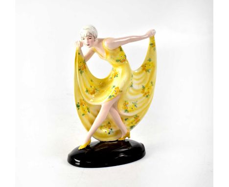 GOLDSCHEIDER; an Art Deco figure by Josef Lorenzl, modelled as a woman dressed in a yellow flowery dress and holding her skir