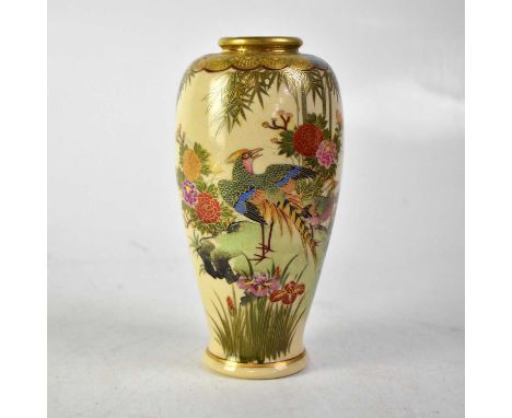 An early/mid-20th century Satsuma vase with polychrome enamel scene of exotic birds among iris, peonies and flora, on a rocky