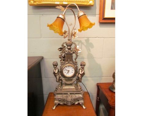A reproduction classical design table lamp/clock 