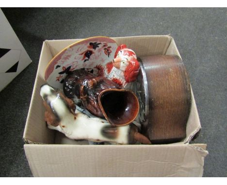 A mixed lot including Staffordshire dog, treacle glazed jug, ceramic spaniel and three staple repaired plates, two being Wedg