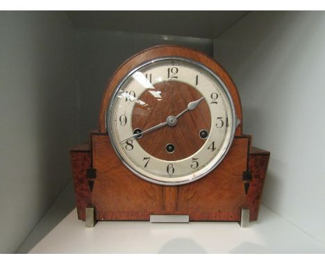 An Art Deco walnut mantel clock with Arabic chapter ring