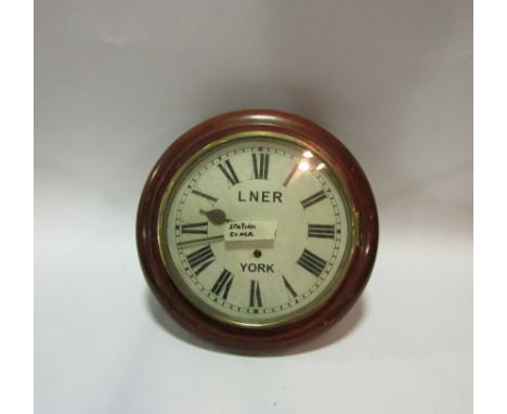 An LNER 'York' station wall clock with over painted number '10907', enamel face and Roman numerals