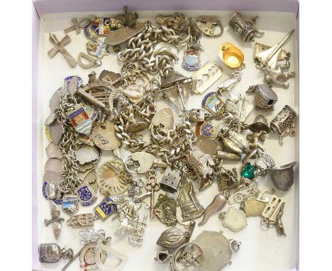 A Quantity of Silver and White Metal Charms, some suspended from bracelets, of varying designsGross weight 283.6 grams.