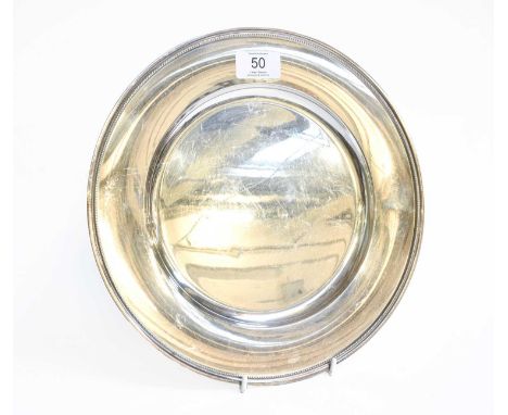 A Continental Silver Dish, Maker's Mark E.T.J., Perhaps Danish, 20th Century, circular and with beaded border, 28.3cm diamete