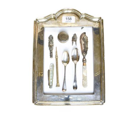 A George V Silver Mounted Photograph Frame, by A. and J. Zimmerman Ltd., Birmingham 1914, 28.5cm by 20.5cm; Together With a s
