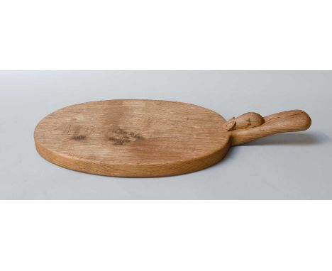 Workshop of Robert Mouseman Thompson (Kilburn): An English Oak Cheese Board, post 1960, of standard form, with carved mouse t
