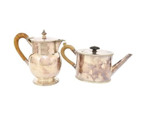 A Silver Plate Teapot and Hot-Water Jug, Second Half 19th Century, the teapot in the George III style oval and with beaded ri