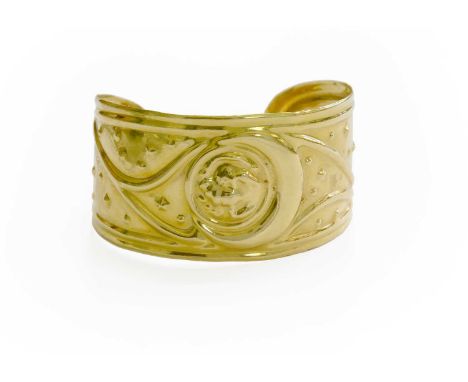 A Zodiac Bangle, stamped '750', measures 5.5cm by 5.3cmThe bangle is in fair condition with dings and scuffing throughout com