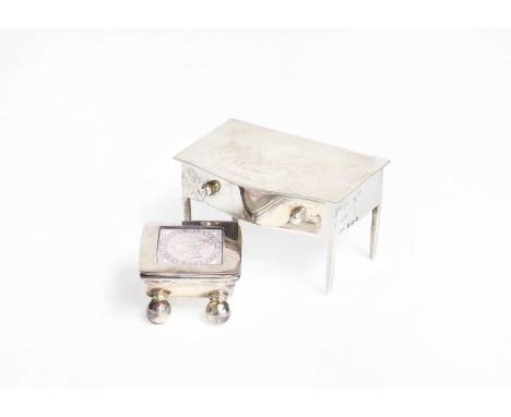 An Edward VII Silver Stamp-Box, by A. and J. Zimmerman, Birmingham, 1909, in the form of a table, with hinged cover, 60mm wid