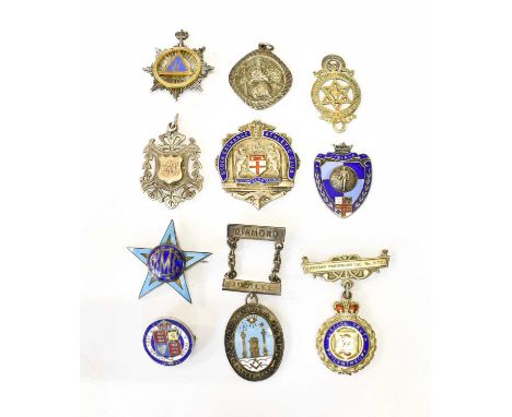 A Collection of Ten Silver or Silver and Enamel Badges, including one for the Stock Exchange Athletic Club; Masonic examples 