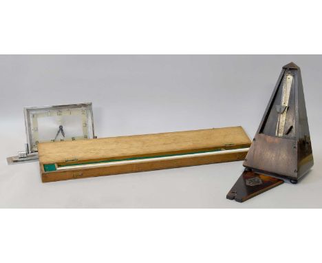 A Cased Conductors Baton, together with a French metronome and an Art Deco chrome eight day mantel timepiece with later quart