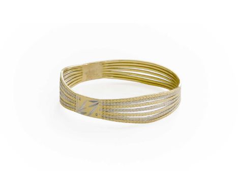 A Bangle, the bi-colour bangle with etched and bead decoration, inner diameter 6cmThe bangle is unmarked but in our opinion w