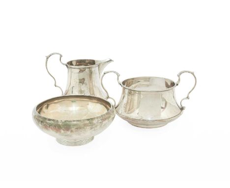A George V Silver Cream-Jug and Sugar-Bowl, by Thomas Edward Atkins, Birmingham, 1911, each piece tapering and with leaf-capp