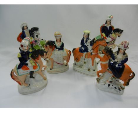 Two pairs of Staffordshire pottery figures on horseback and two other Staffordshire horse and rider groups CONDITION REPORT: 
