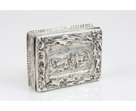 Victorian silver snuff box with cast hunting scene decoration to the hinged lid depicting horse, hounds and huntsman, border 