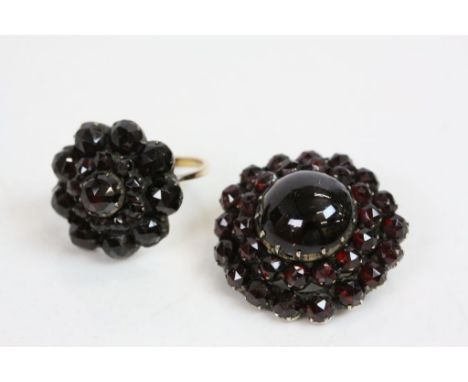 Victorian Bohemian garnet yellow metal cluster ring, the three tier cluster set with rose cut garnets, collet and claw settin