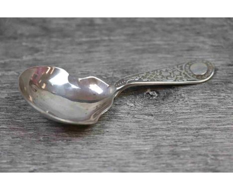 Victorian silver caddy spoon, foliate and bell flower decoration in relief to stem, initialled circular cartouche, plain bowl