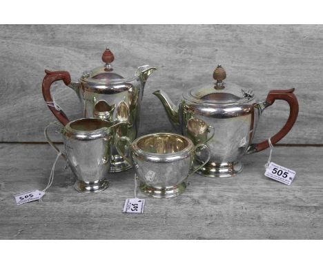 George VI four piece silver tea service comprising teapot, hot water pot, twin handled sugar bowl and milk jug, of plain poli