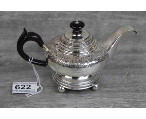 Pre 1886 Hamburg silver bachelor teapot raised on four ball feet, engraved floral and foliate decoration to body, repeating b