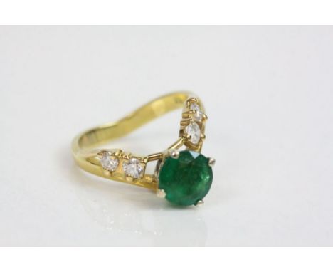 Emerald and diamond 18ct yellow gold wishbone ring, the round mixed cut emerald  measuring approximately 7mm diameter, four c