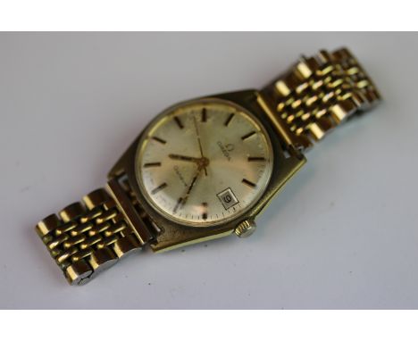 Gents Omega Wristwatch, the silvered metallic dial marked "Omega Geneve, with sweep seconds hand &amp; date box at the three 