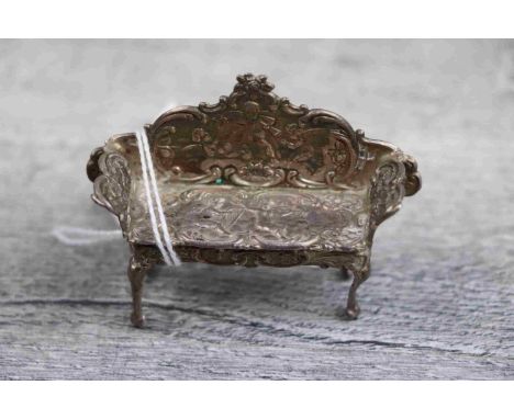 Silver novelty trinket, modelled as a miniature 18th century style sofa, raised on four cabriole legs, the framework and body