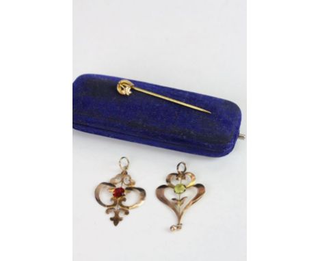 Two Edwardian gem set 9ct rose gold pendants, together with a yellow gold horseshoe stick pin, boxed (3)  