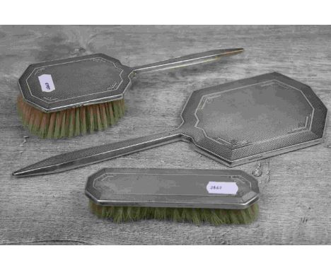 George VI three piece dressing table silver brush set comprising mirror, hair brush and clothes brush, engine turned and step