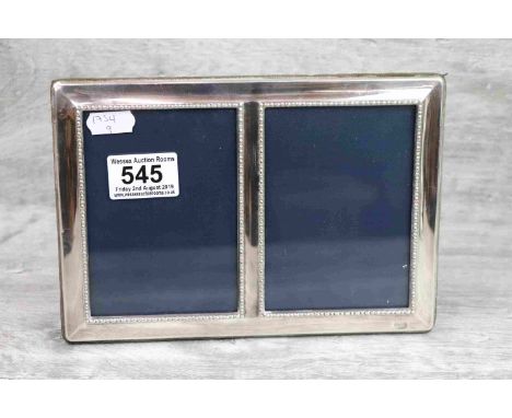 Silver double photograph frame, easel back, plain polished border surround with bead detailing, makers Carr's of Sheffield Lt
