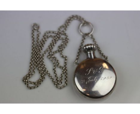 Silver scent bottle of circular form, suspended from silver belcher link chain, engraved initials and date, screw finial, mak