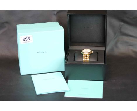 Boxed Gents 18k Yellow Gold Tiffany &amp; Co Tesoro Chronometer Wristwatch with matching strap, approx 36mm diameter, not cou