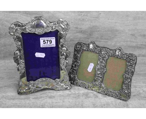 Edwardian silver easel back photograph frame with repousse rising sun, cherub and floral decoration, blank cartouche to surmo