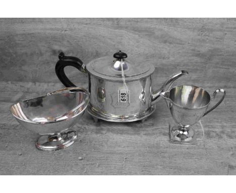 George III silver three piece tea service comprising teapot, teapot stand, milk jug and swing handled sugar bowl, plain polis