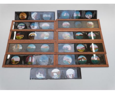 A collection of magic lantern slides including shipping, castles etc, in original case