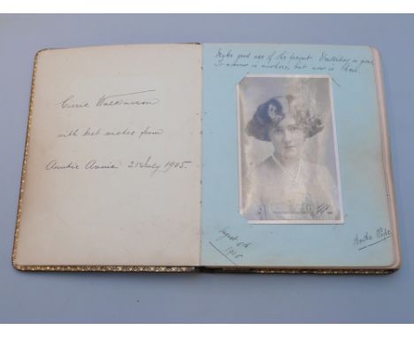 Edwardian autograph and sketch book including Nell Payne Jewellers window drawing, Doris Bean figures in a winter scene etc 
