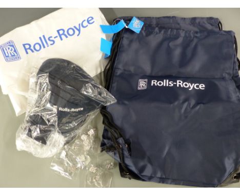 A collection of Rolls-Royce memorabilia including cap, bags and eleven tie pins/badges 