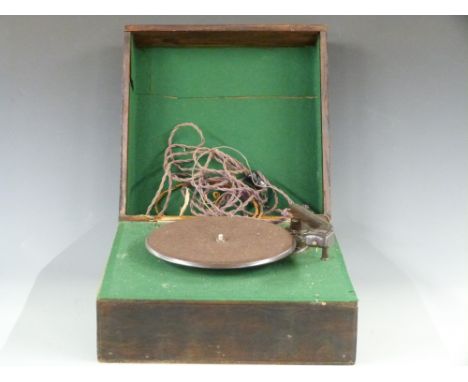 An early Garrard portable record player with Bakelite arm and base
