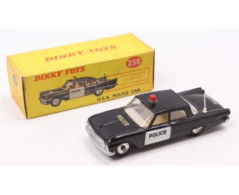 Dinky Toys No. 258 USA Police Car, black body with white door fronts, Police on doors, bonnet and boot, red roof light, cream