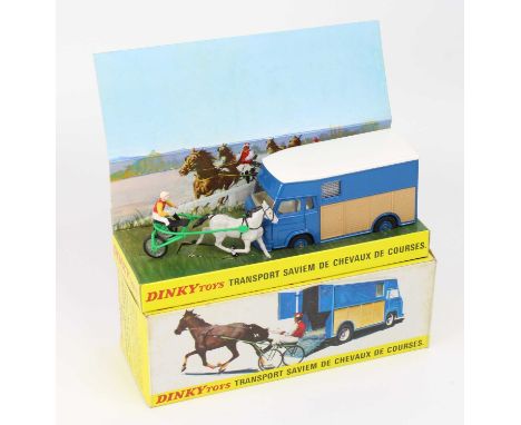 French Dinky Toys No. 571 Transport Saviem de Chevaux de Courses, comprising a blue body, with a white roof, wood effect side