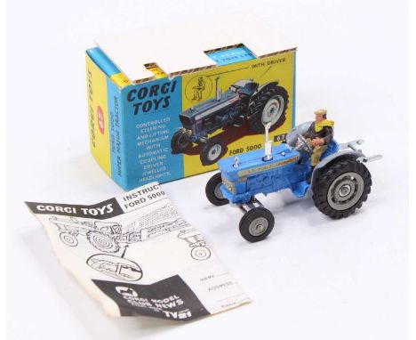 Corgi Toys No. 67 Ford 5000 Super Major Tractor finished in blue with grey hubs and driver figure, complete with packing card