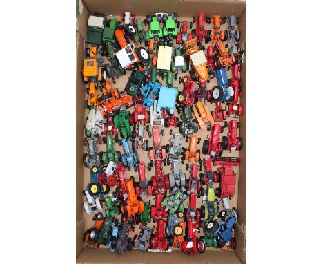 A tray containing Hachette Universal Hobbies tractors and farming related diecasts, with specific examples including a Ford 5