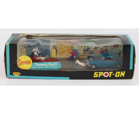 Spot-On No. 803 Superville Garage with Tommy Spot, containing 286 Austin 1800 in blue with red interior and driver, 2 mechani