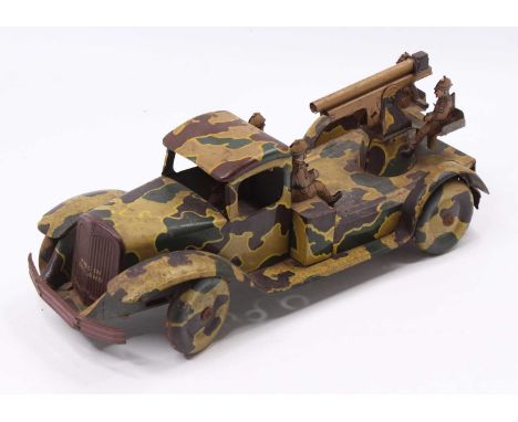 A Wells Brimtoy tinplate and clockwork model of an army lorry fitted with anti aircraft gun, all over camouflage decoration w