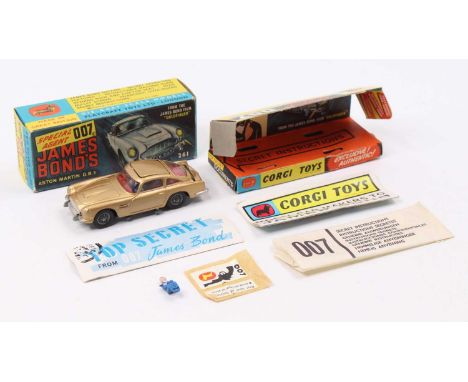 Corgi Toys No. 261 James Bond Aston Martin DB5 comprising of gold body with red interior, and cast wire work hubs, all mechan