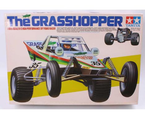 A Tamiya 1/10th scale No. 5843 The Grasshopper Off Road Racer, a complete kit in its original and very clean box