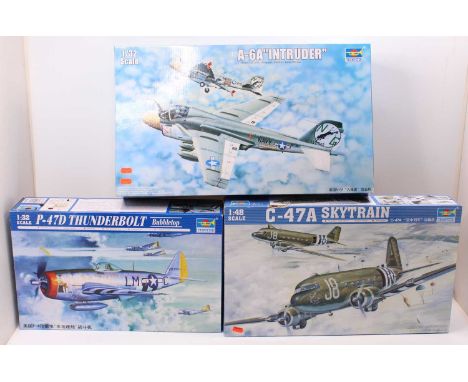 A Trumpeter 1/32 and 1/48 scale boxed plastic aircraft kit group to include a No. 02828C-47A Skytrain, a No. 02249A-6A Intrud