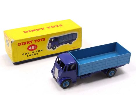 Dinky Toys No. 431 Guy 4 Ton Lorry in mid and dark blue, with mid blue hubs, and silver trim, sold in the original yellow car